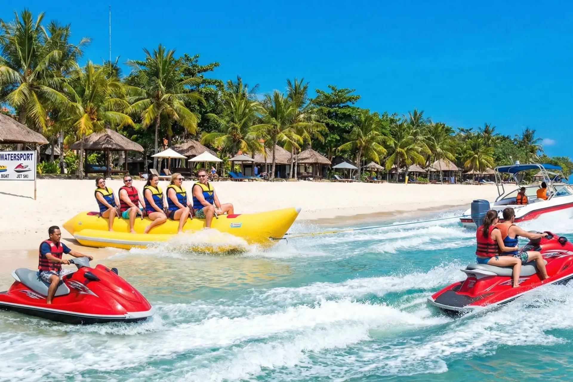 Bali watersport activities with banana boat ride and jet ski at a tropical beach